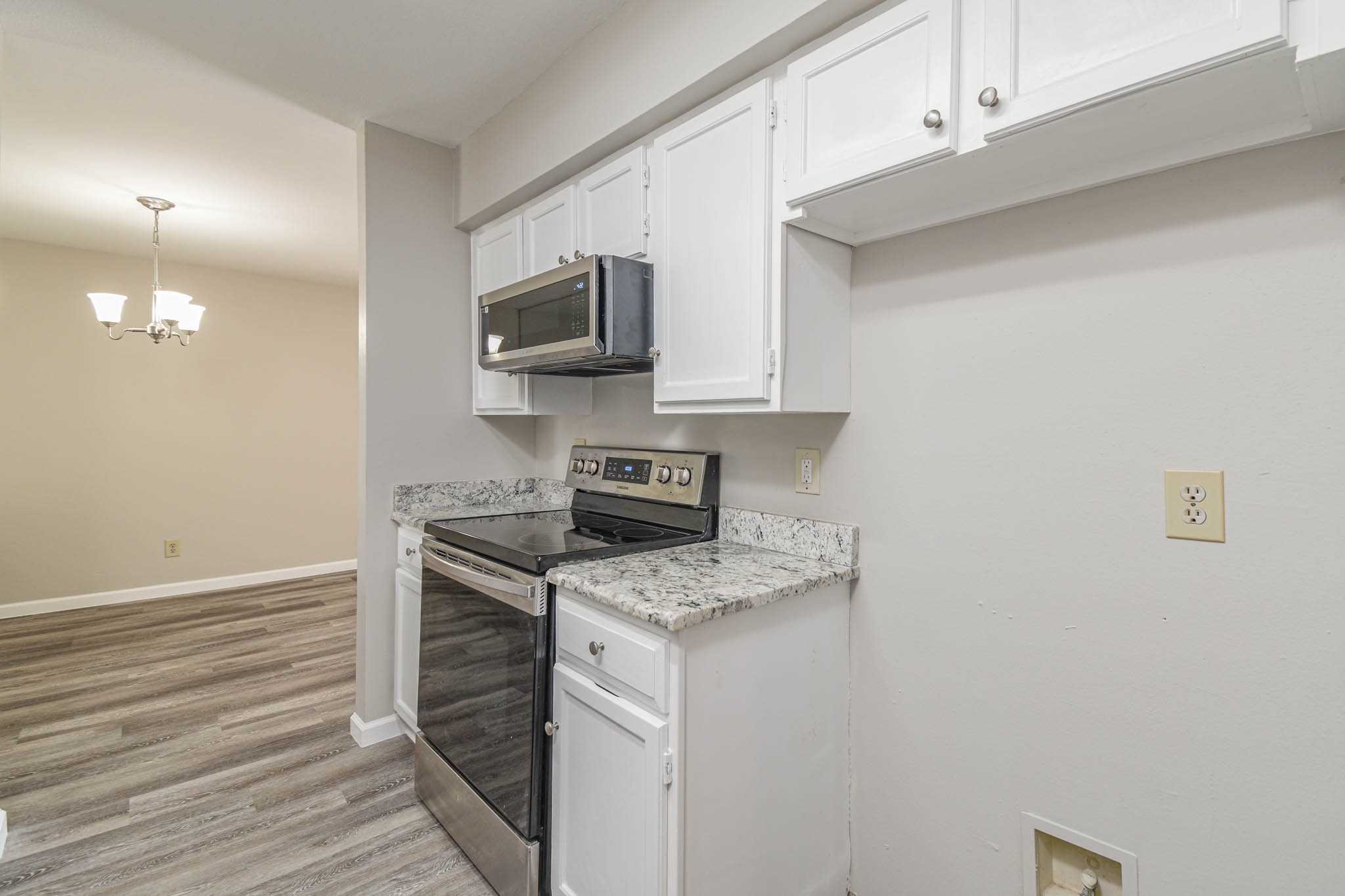 8787 Brae Acres Road, Unit 814 Houston, TX 77074 - Photo 10 of 23 a kitchen with stainless steel appliances granite countertop a sink a stove top oven a counter space and cabinets