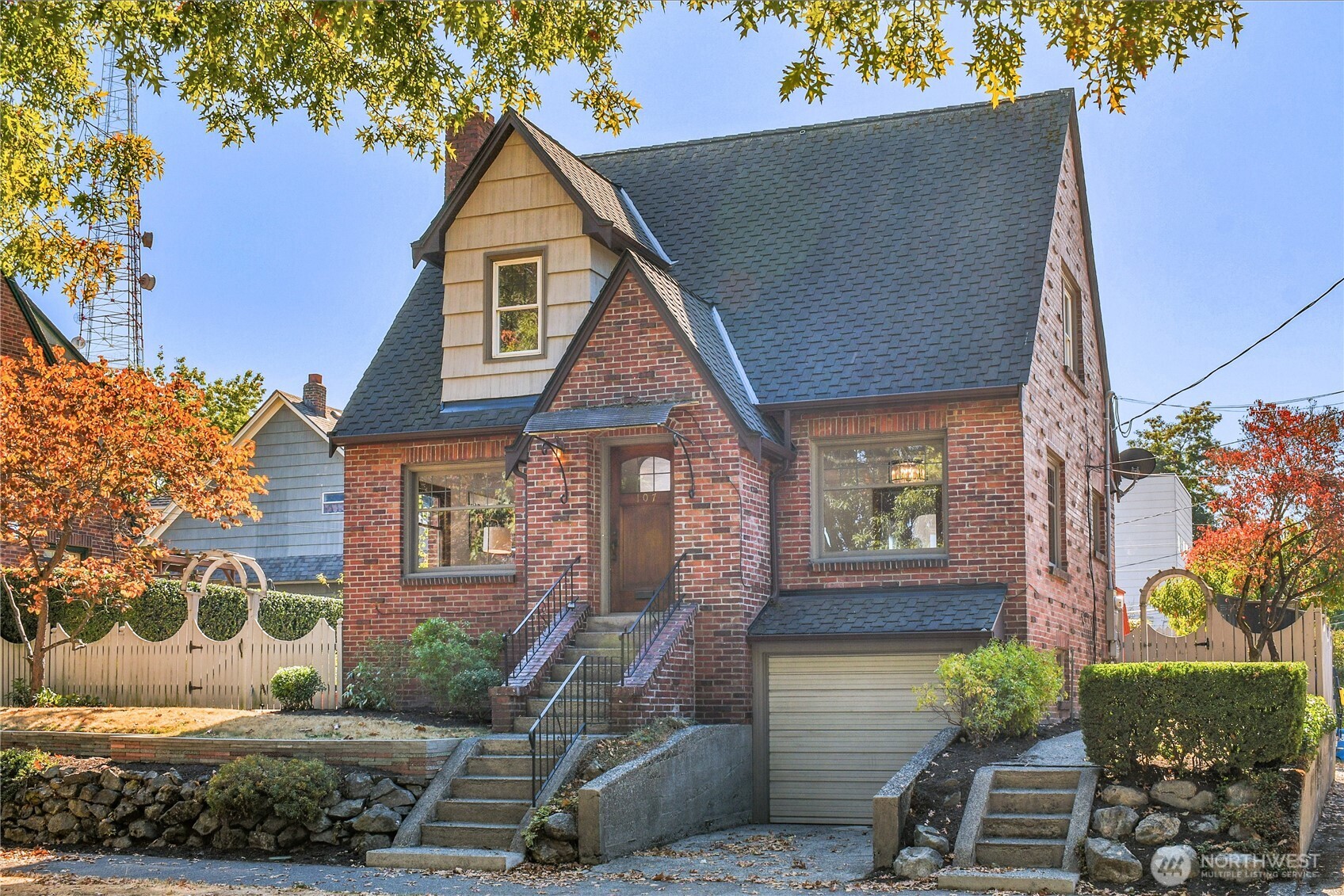 107 West Blaine Street Seattle, WA 98119 - Photo 1 of 22 a front view of a house with a yard