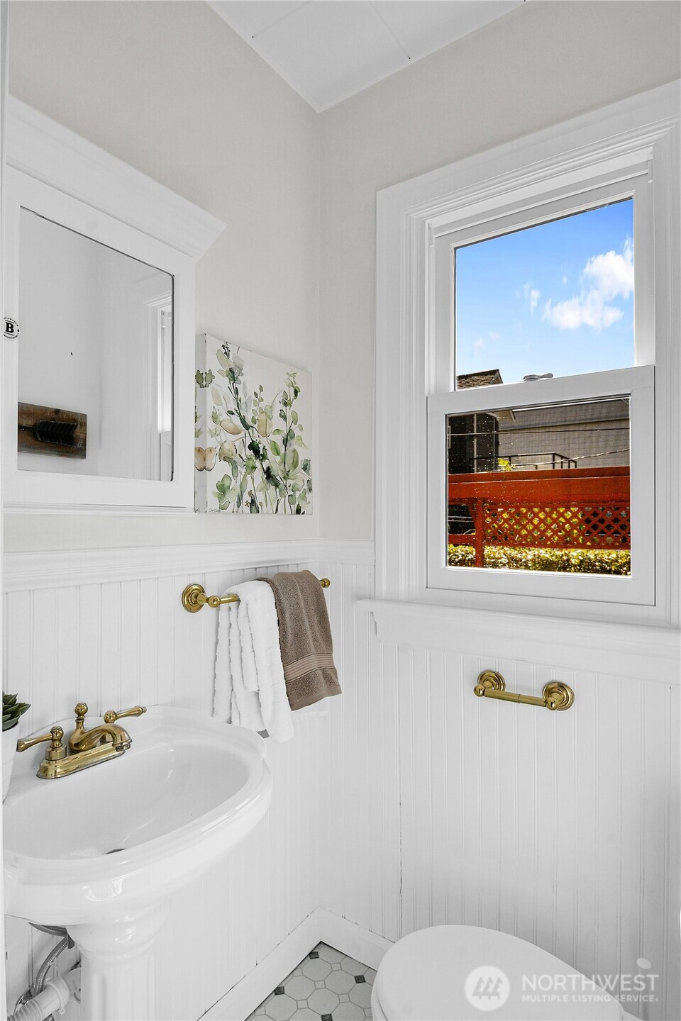 107 West Blaine Street Seattle, WA 98119 - Photo 11 of 22 a bathroom with a sink and a mirror