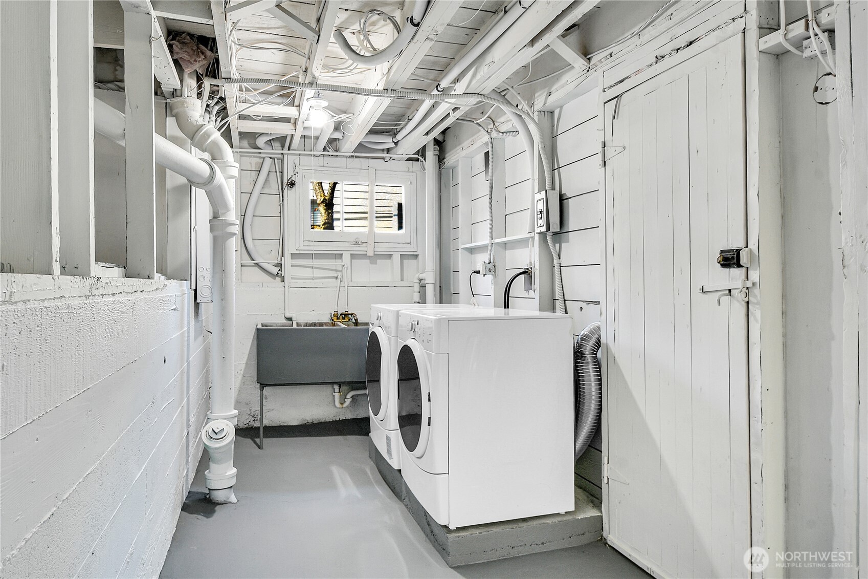 107 West Blaine Street Seattle, WA 98119 - Photo 17 of 22 a utility room with dryer and washer