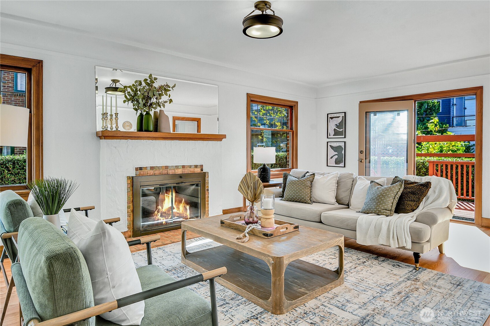 107 West Blaine Street Seattle, WA 98119 - Photo 2 of 22 a living room with furniture and a fireplace