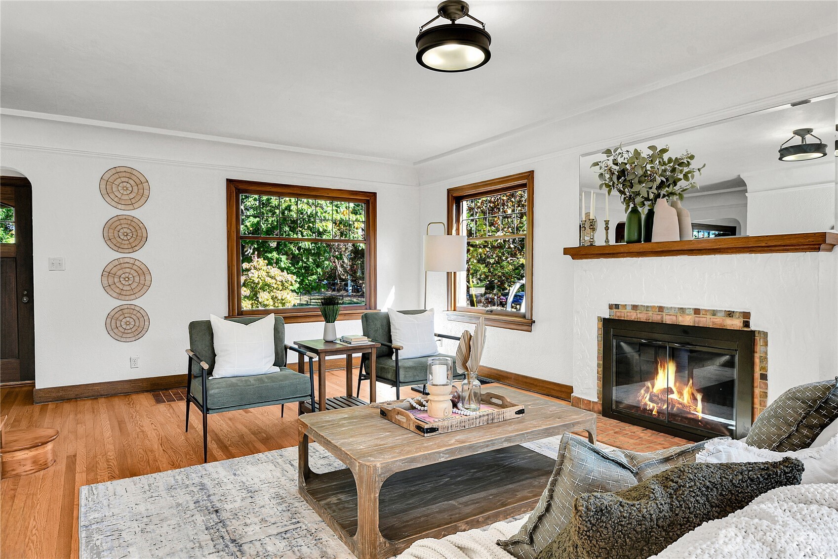 107 West Blaine Street Seattle, WA 98119 - Photo 3 of 22 a living room with furniture and a fireplace