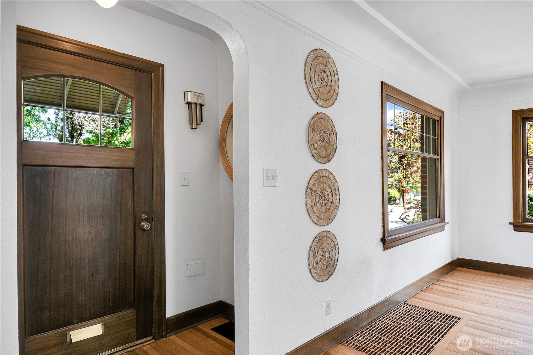 107 West Blaine Street Seattle, WA 98119 - Photo 5 of 22 a view of entryway with wooden floor and door