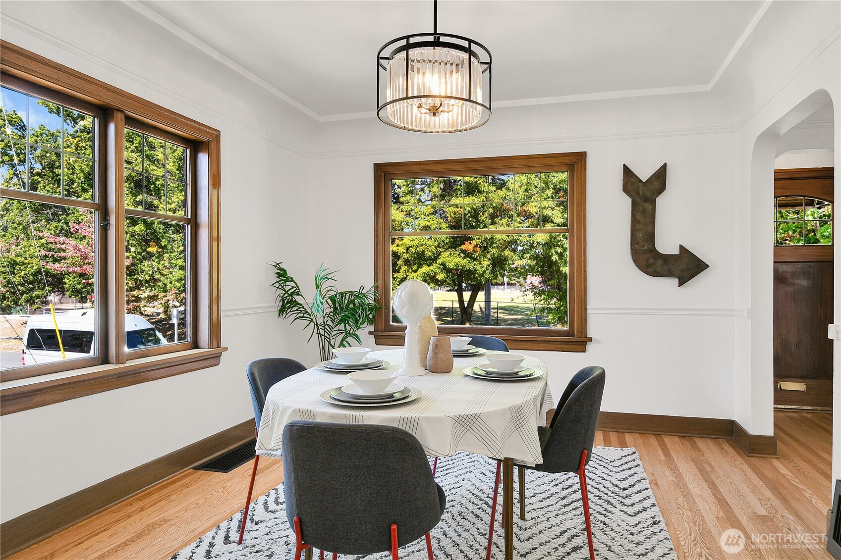 107 West Blaine Street Seattle, WA 98119 - Photo 6 of 22 a dining room with furniture a window and wooden floor