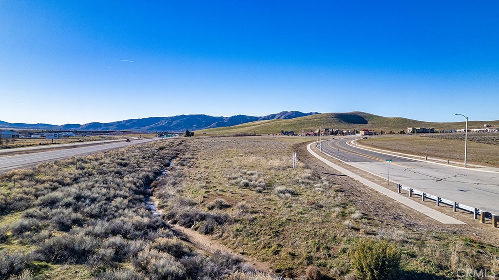 8 Challenger Drive Tehachapi, CA 93561 - Photo 4 of 7 a view of a dry yard with wooden fence