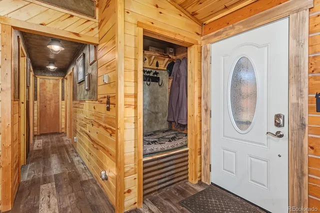 a bathroom with a glass door shower and a sink