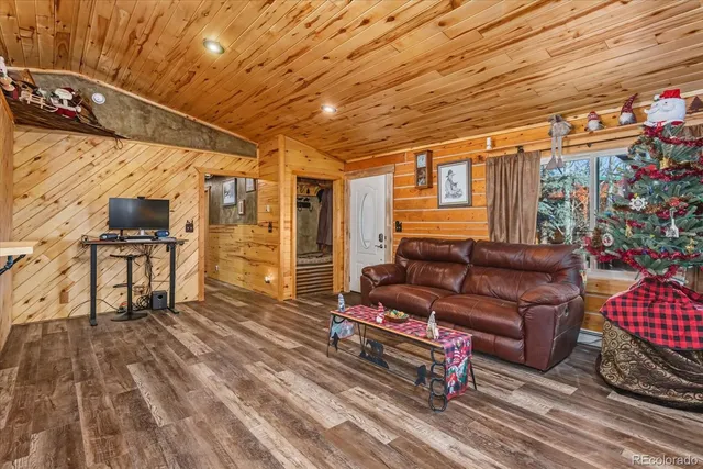a outdoor living space with furniture and a rug