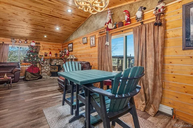 a view of a patio with table and chairs with wooden floor