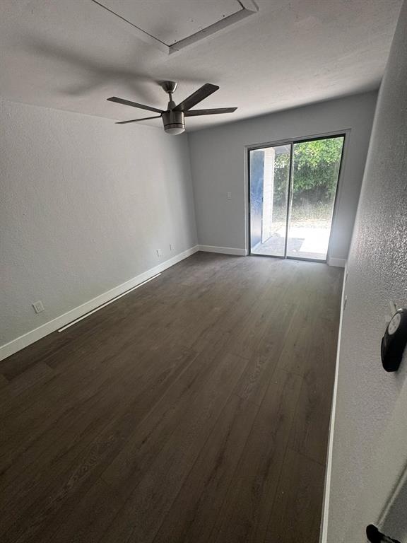 836 Southwest 64th Terrace, Unit A Gainesville, FL 32607 - Photo 3 of 13 an empty room with a window