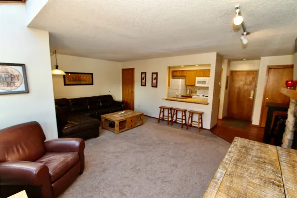 a bedroom with furniture and wooden floor