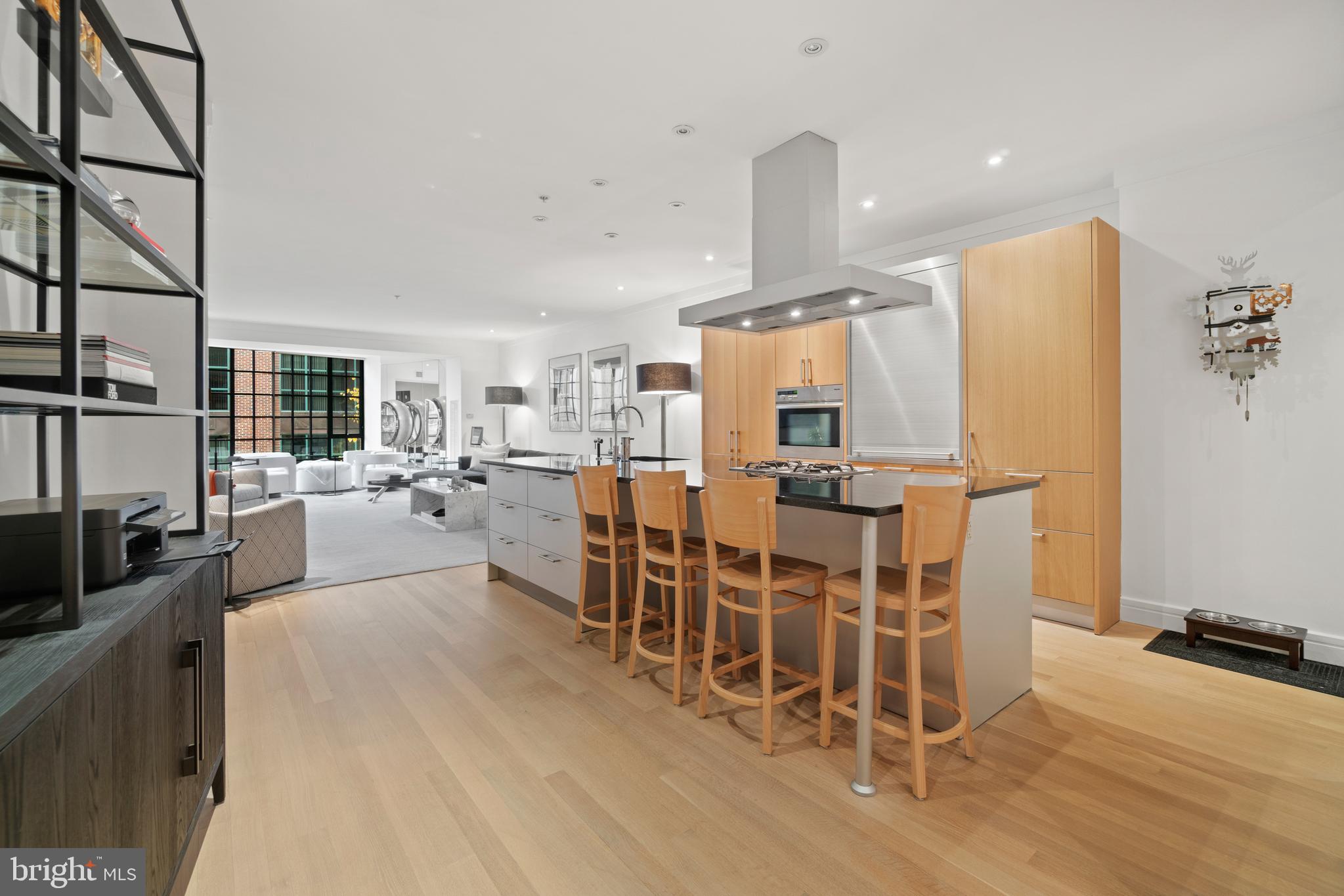 a large kitchen with a table and chairs