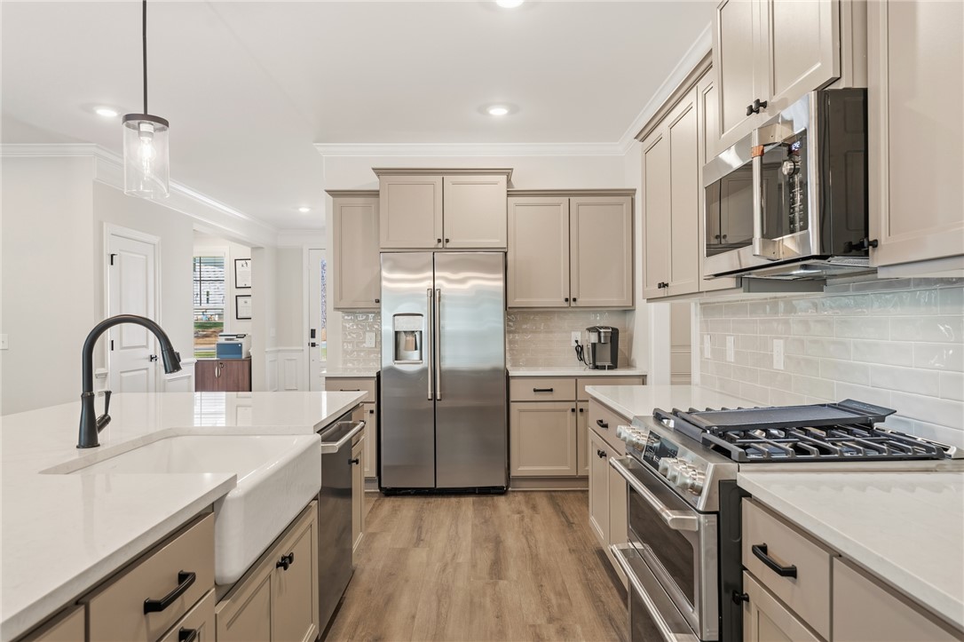 701 Weathered Oak Way Anderson, SC 29621 - Photo 6 of 41 This bright kitchen features modern appliances and elegant finishes throughout the space.