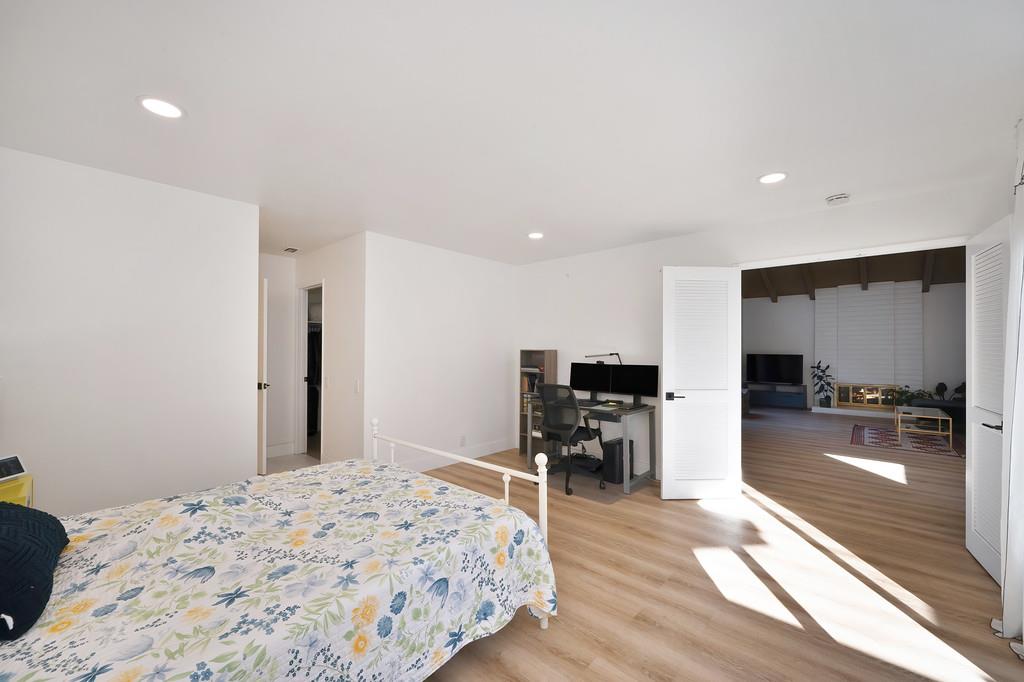 224 East Ranch Road Sacramento, CA 95825 - Photo 19 of 65 a bedroom with a bed and a flat screen tv