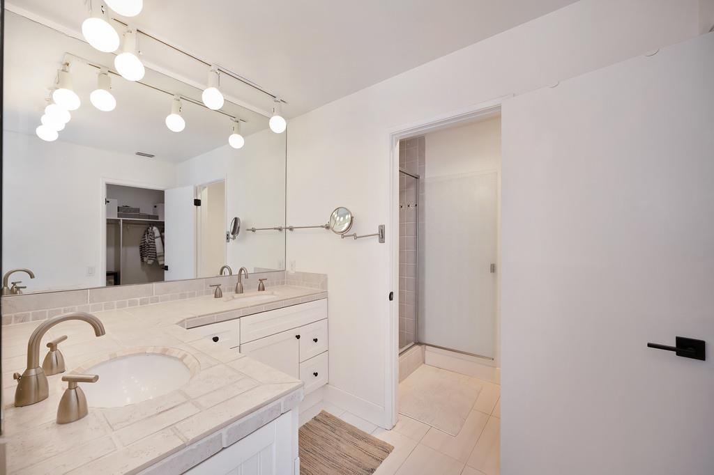 224 East Ranch Road Sacramento, CA 95825 - Photo 22 of 65 a bathroom with a sink vanity and a mirror