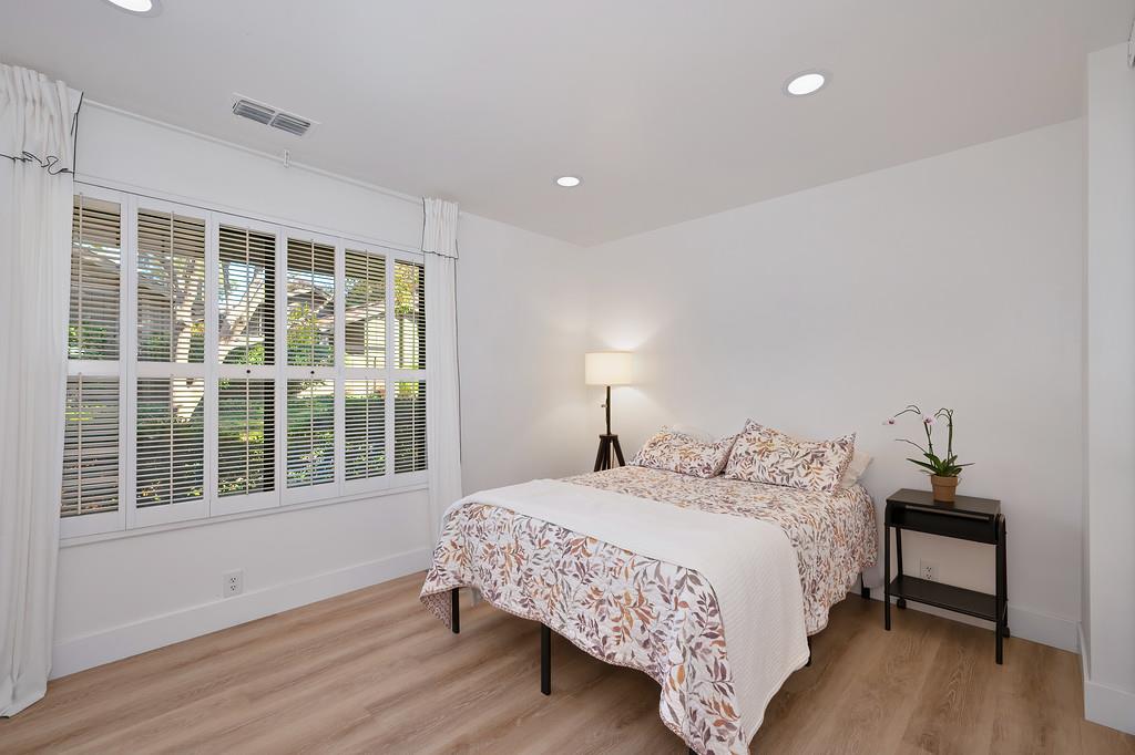 224 East Ranch Road Sacramento, CA 95825 - Photo 27 of 65 a bedroom with a bed and wooden floor