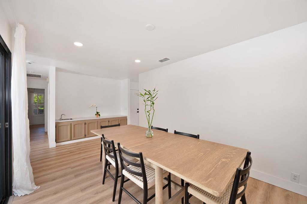 224 East Ranch Road Sacramento, CA 95825 - Photo 32 of 65 a view of a dining room with furniture and wooden floor