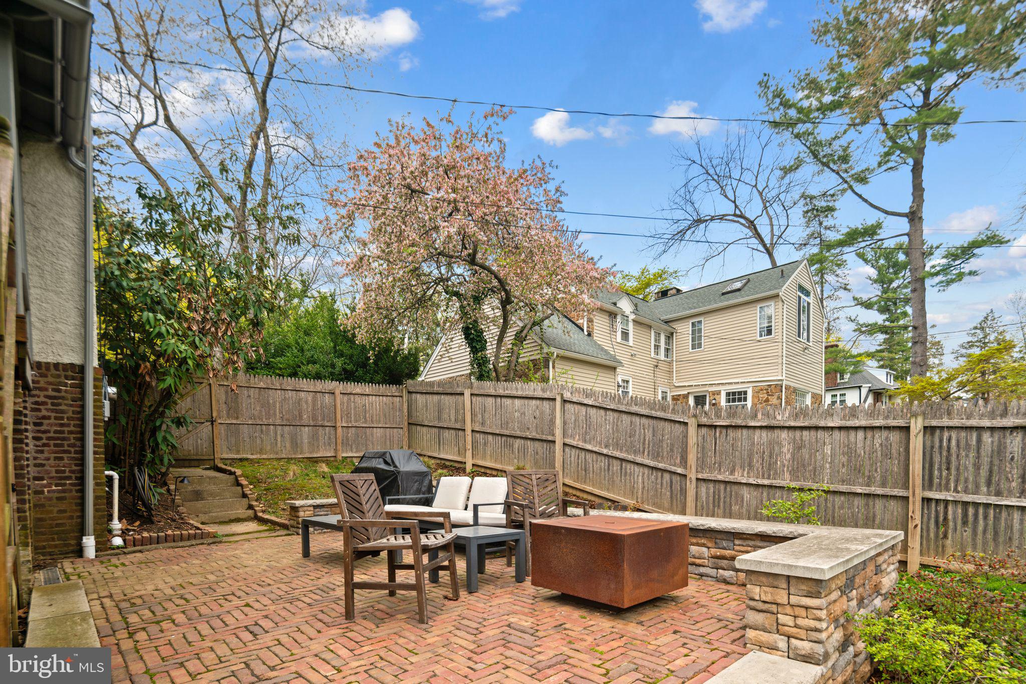 721 Rugby Road Bryn Mawr, PA 19010 - Photo 14 of 38 a view of a chairs and tables in the back yard of the house