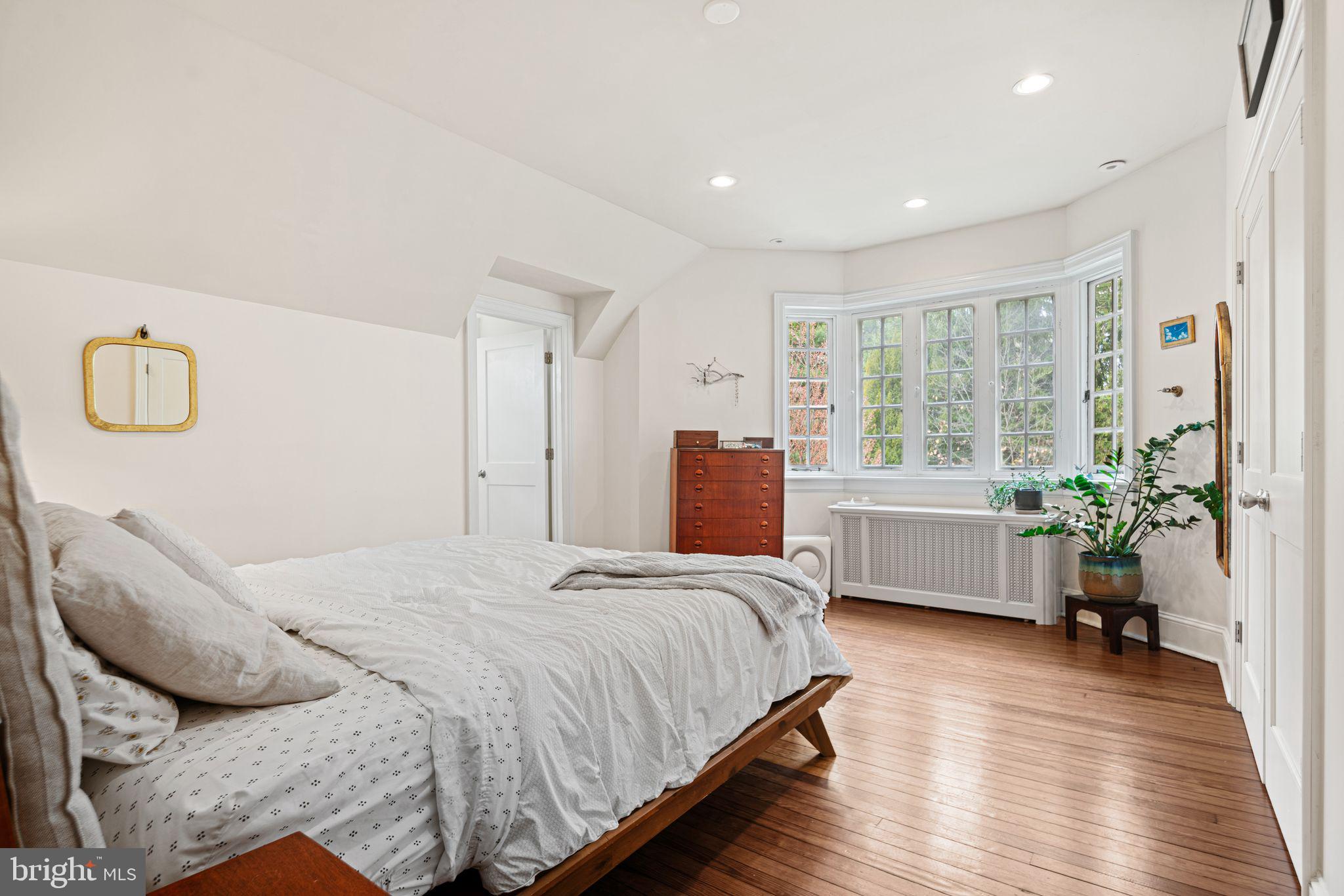 721 Rugby Road Bryn Mawr, PA 19010 - Photo 18 of 38 a bedroom with a bed and a large window