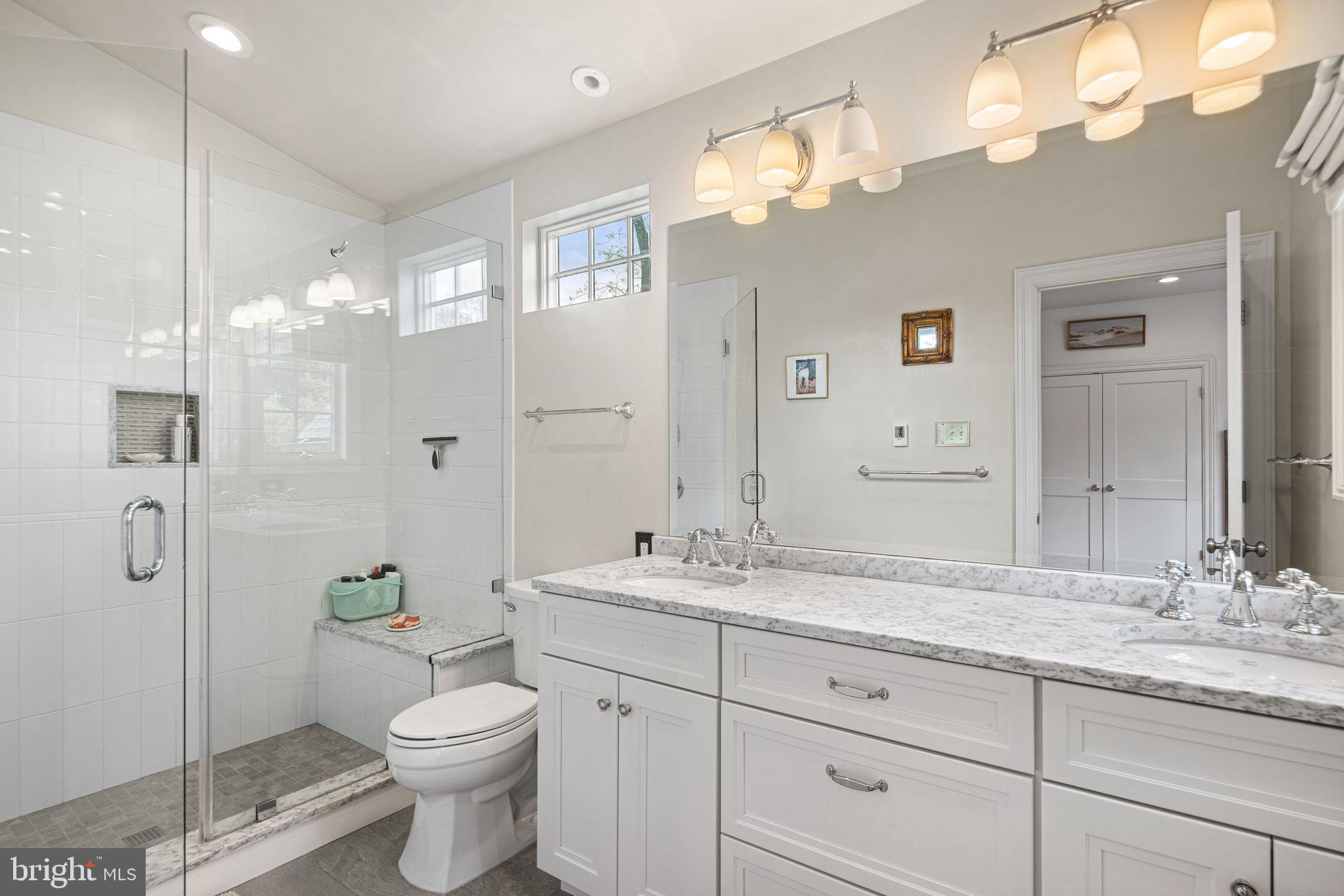 721 Rugby Road Bryn Mawr, PA 19010 - Photo 19 of 38 a bathroom with a granite countertop sink mirror and toilet