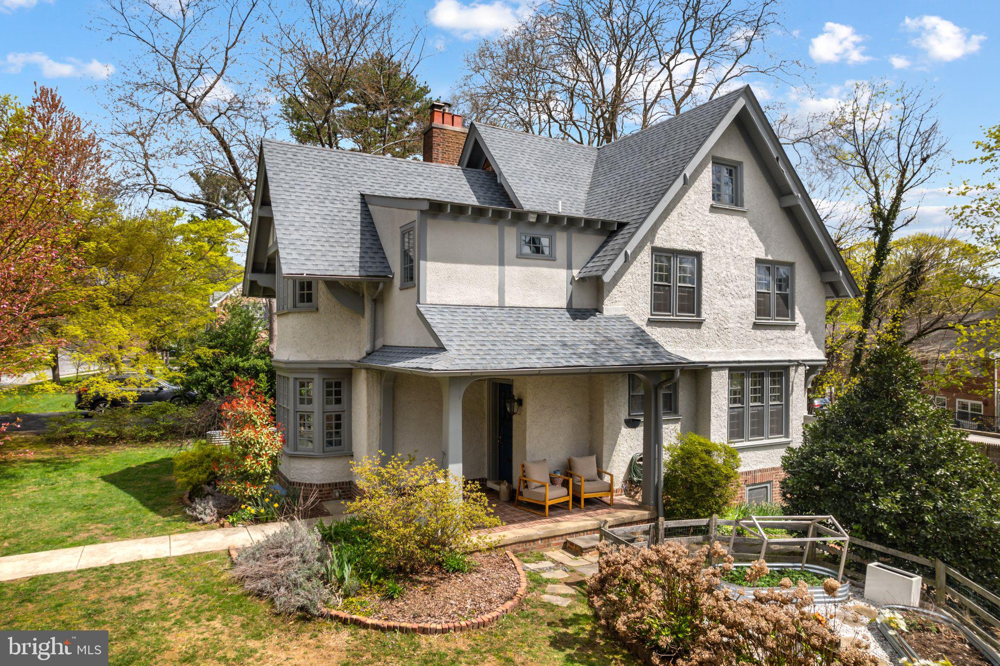 721 Rugby Road Bryn Mawr, PA 19010 - Photo 2 of 38 a front view of a house with a yard outdoor seating and garage