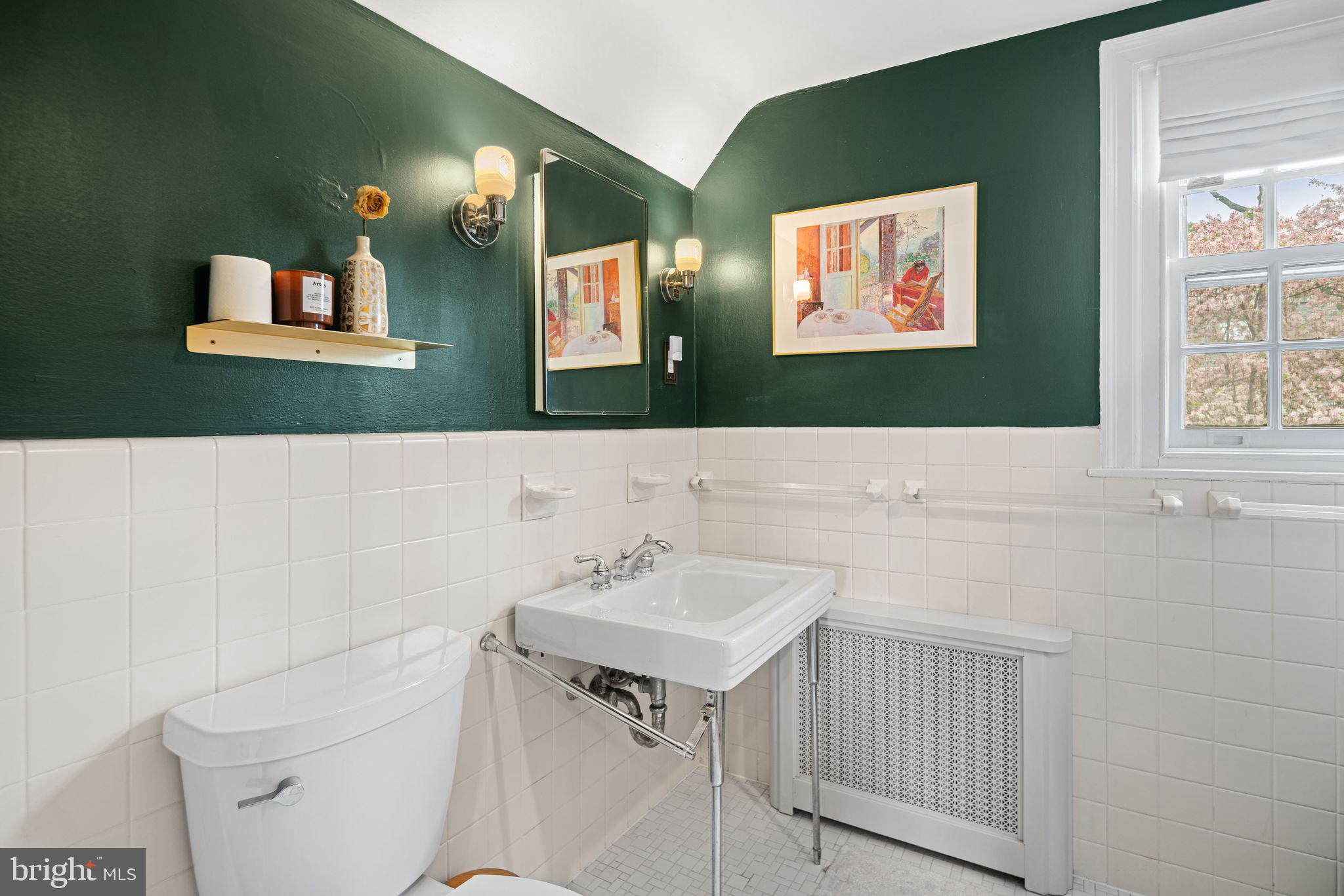 721 Rugby Road Bryn Mawr, PA 19010 - Photo 21 of 38 a bathroom with a sink and a mirror