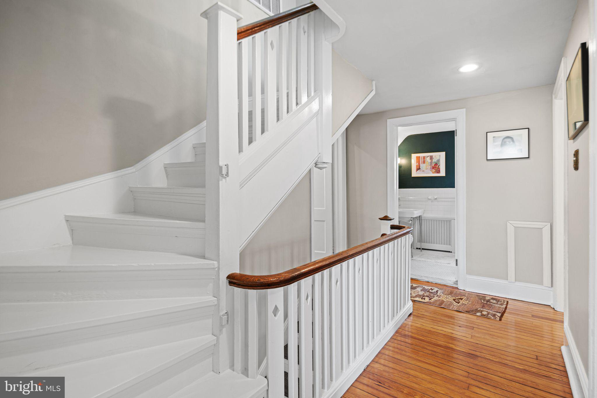 721 Rugby Road Bryn Mawr, PA 19010 - Photo 27 of 38 a view of staircase with wooden floor and white walls