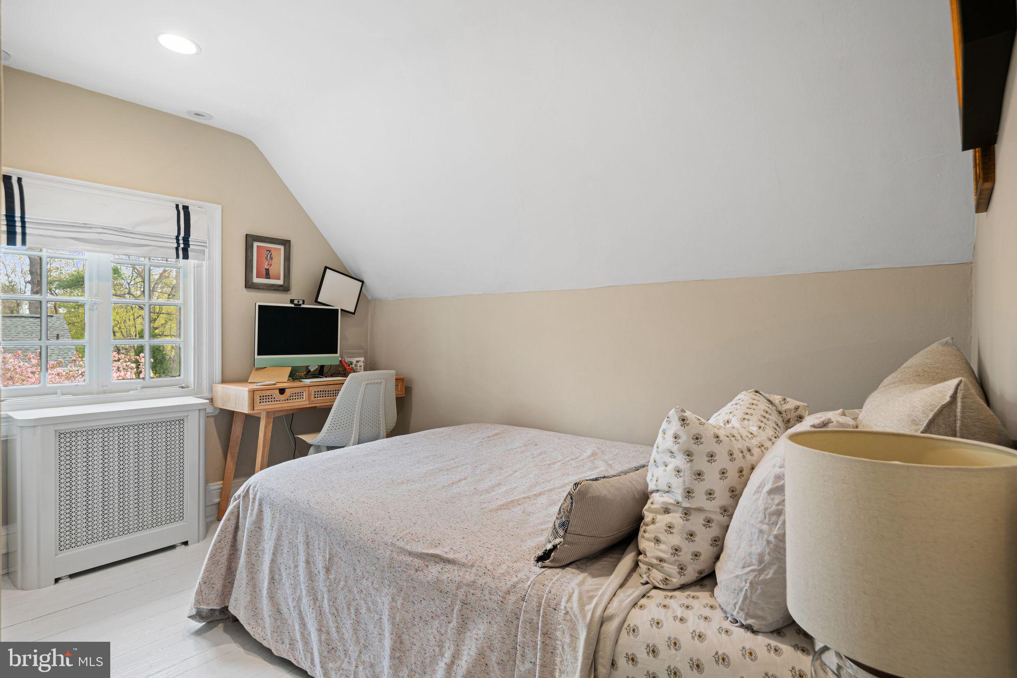 721 Rugby Road Bryn Mawr, PA 19010 - Photo 31 of 38 a bedroom with a bed and a flat screen tv