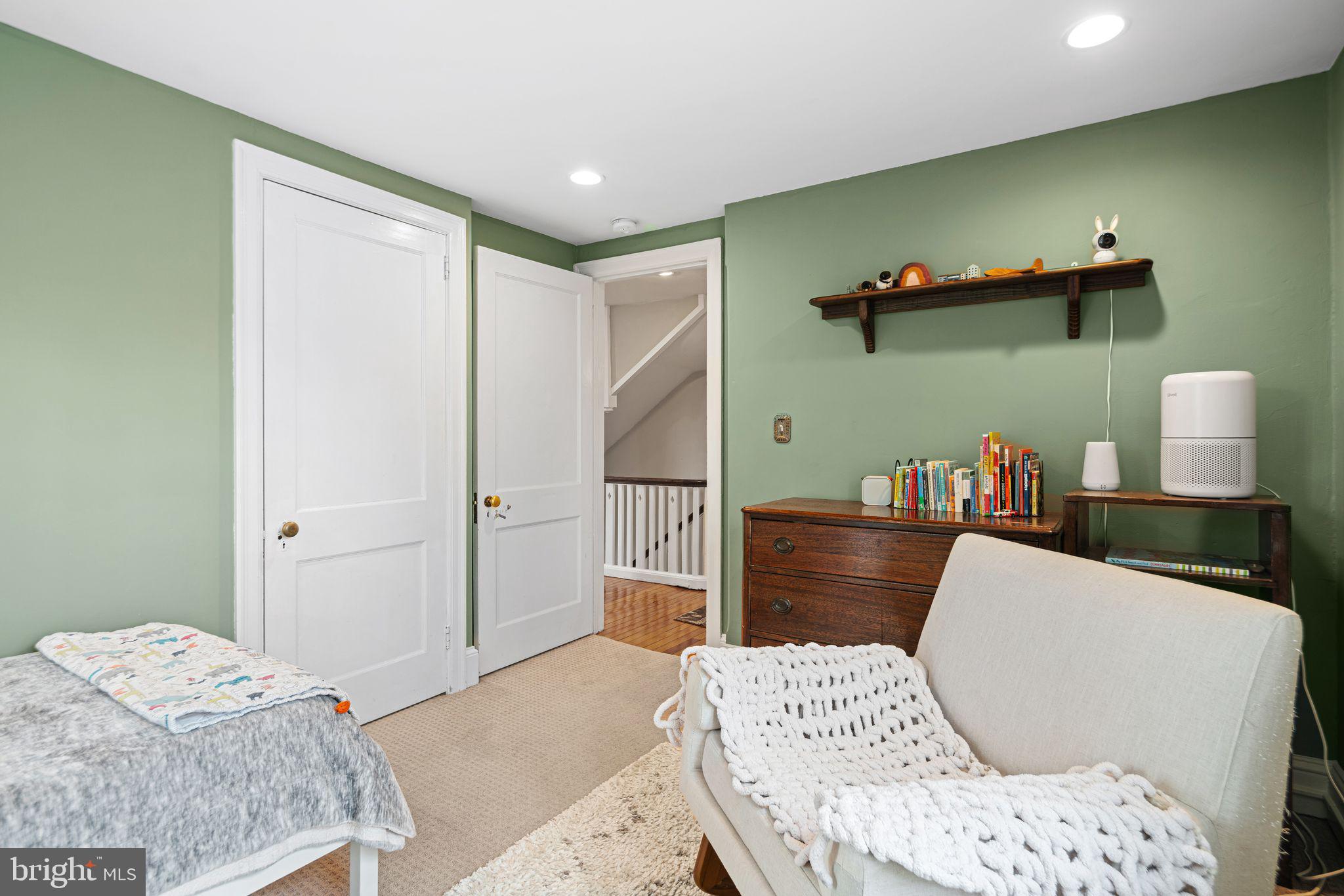 721 Rugby Road Bryn Mawr, PA 19010 - Photo 32 of 38 a bedroom with a bed and wooden floor
