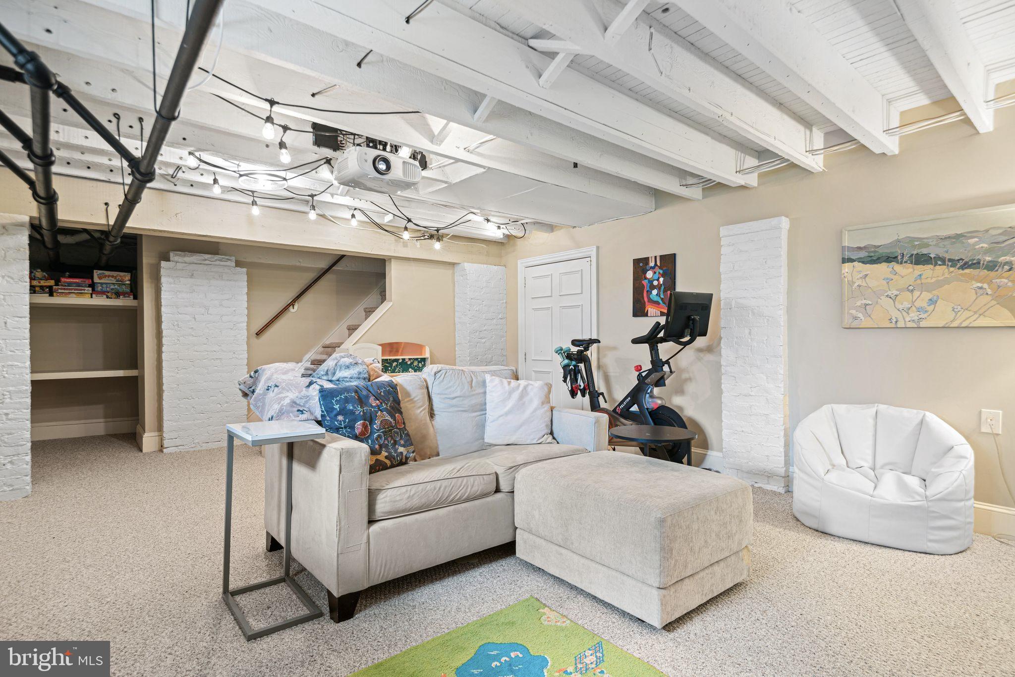 721 Rugby Road Bryn Mawr, PA 19010 - Photo 33 of 38 a living room with furniture and a chandelier