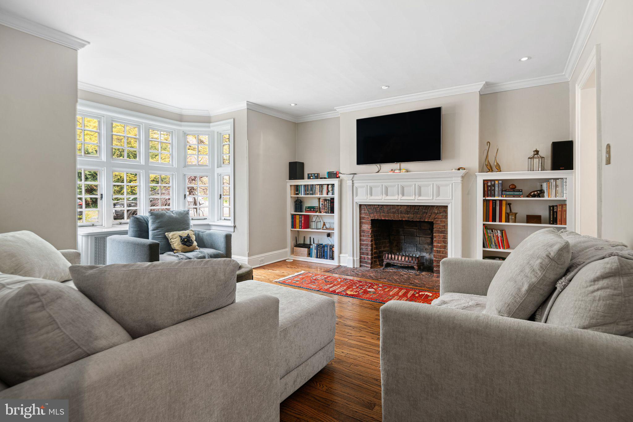 721 Rugby Road Bryn Mawr, PA 19010 - Photo 5 of 38 a living room with furniture fireplace and flat screen tv