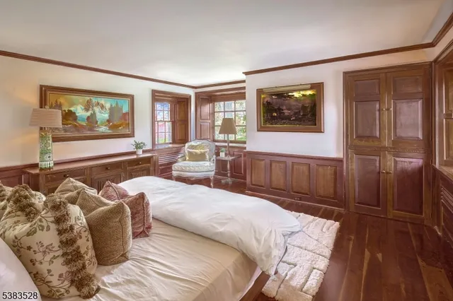 a living room with furniture and large window with flat screen tv