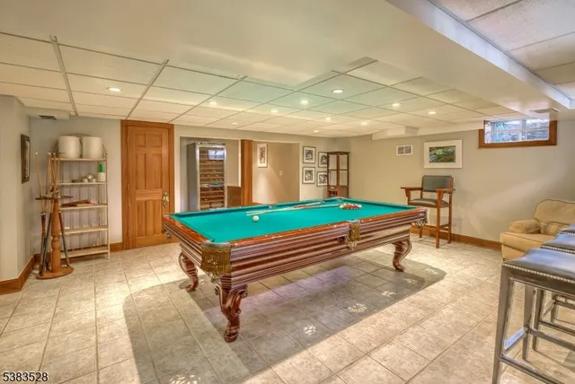 a bathroom with a toilet a sink and a window