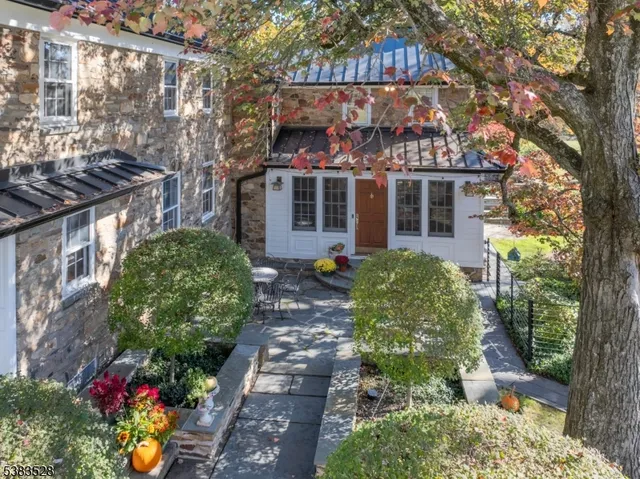 a view of backyard of house with green space