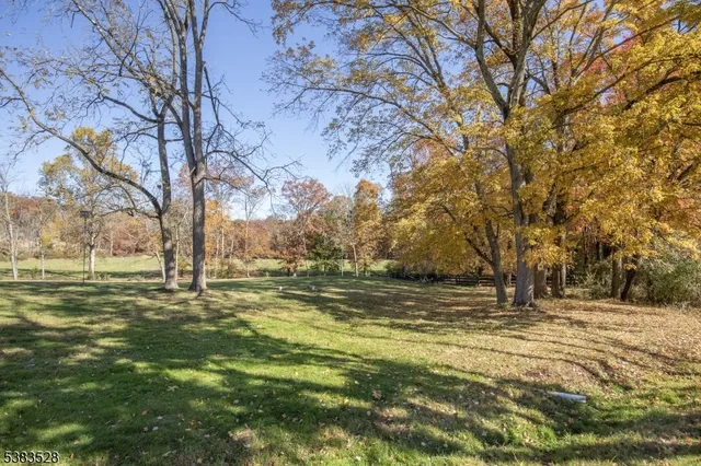 an aerial view of houses with yard