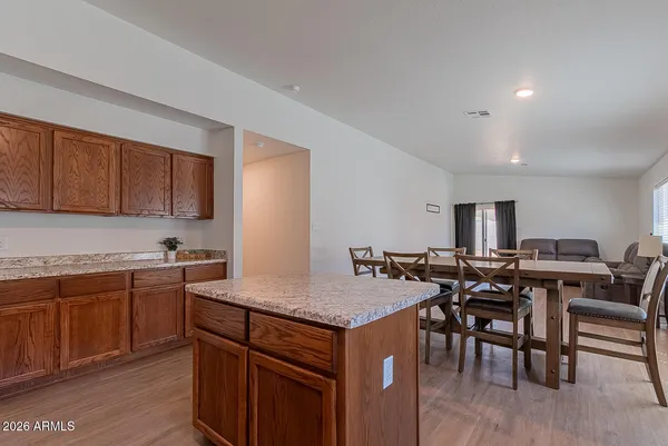 a kitchen with a table and chairs in it