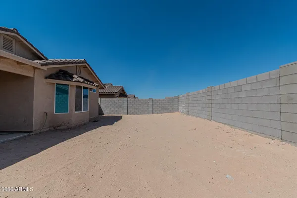 a view of a house with a yard and garage