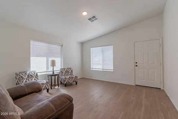 a living room with furniture and windows