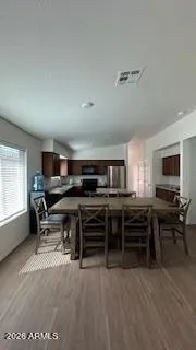 a view of a workspace with furniture and windows