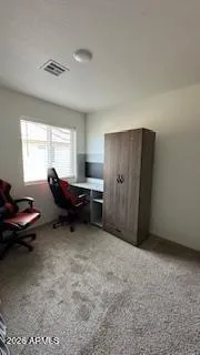 a living room with furniture a window and a table