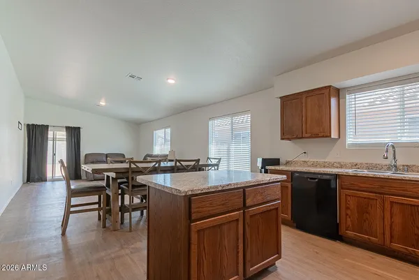 a kitchen with lots of counter top space and dining table