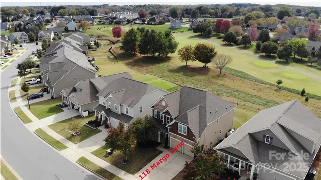 an aerial view of a house with outdoor space