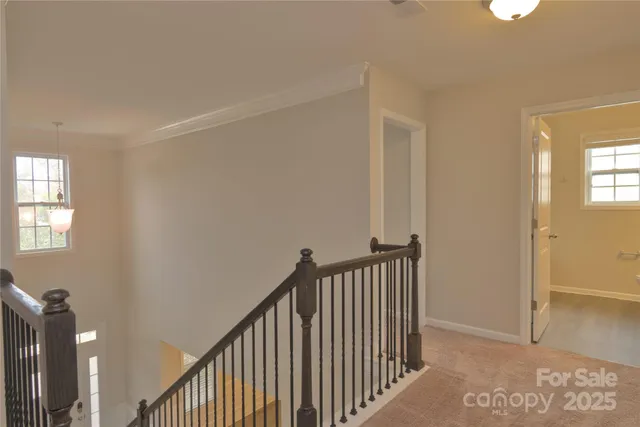 a view of a hallway with windows