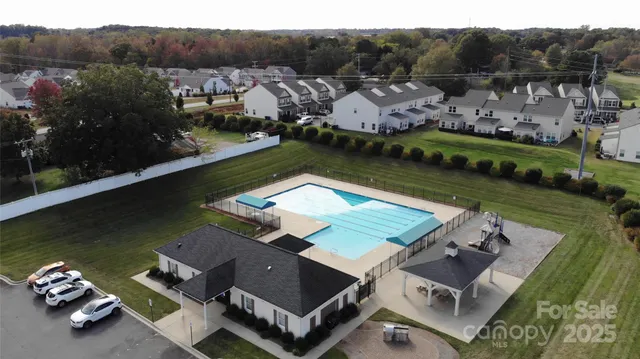 an aerial view of a house with a garden