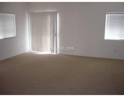 8839 Roping Rodeo Avenue, Unit 103 Las Vegas, NV 89178 - Photo 2 of 10 Living Room.