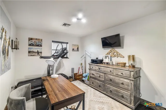 a room with furniture and a flat screen tv