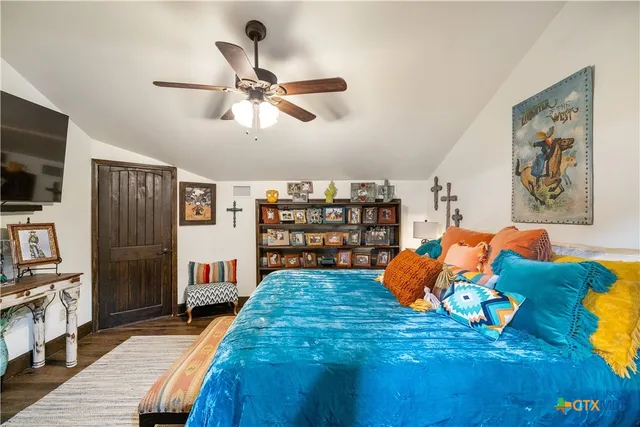 a bed room with a bed and a tv