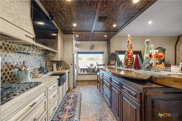 a kitchen with stainless steel appliances granite countertop lots of counter top space