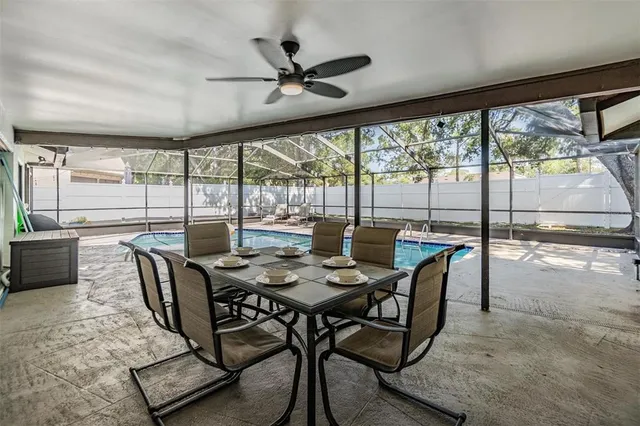 a view of a dining room with furniture window and outside view