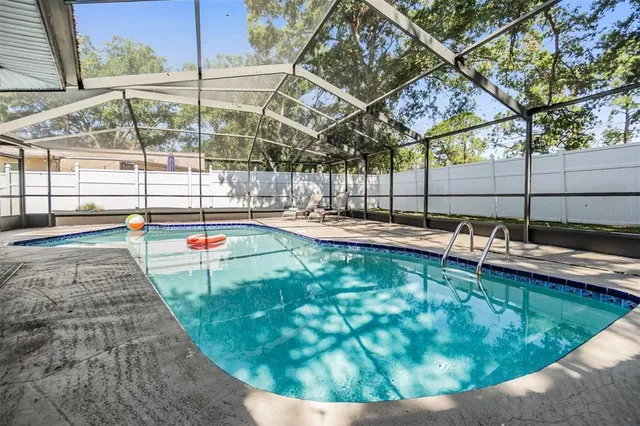 a view of a swimming pool with a porch