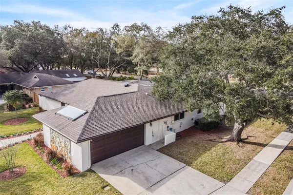 a aerial view of a house with a yard